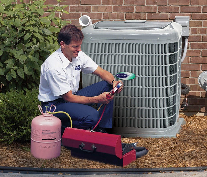 An HVAC technician completing AC repairs